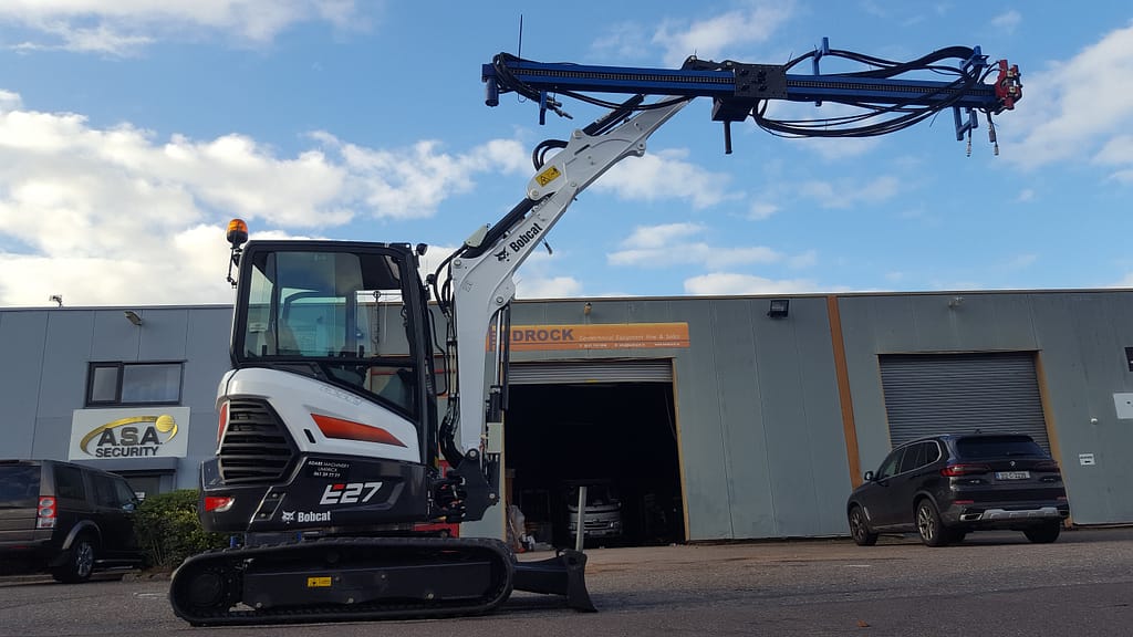 Drill mast equipped on a bobcat