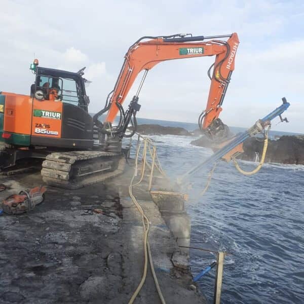Bedrock drill mast completing coastal work